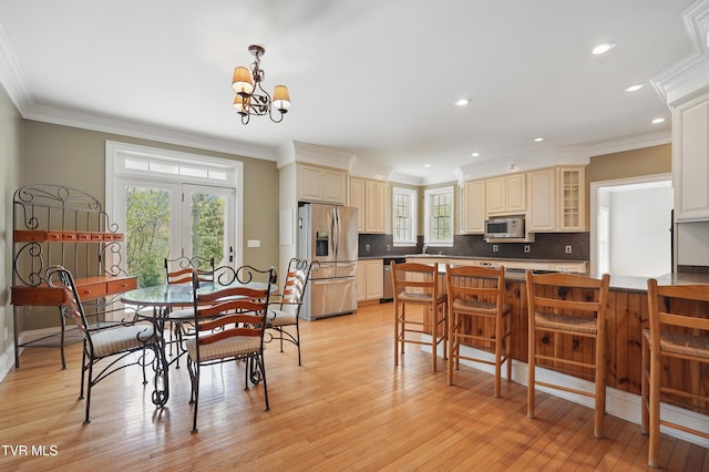 500 NW Ridge Ave, Norton, VA 24273 - dining space featuring a chandelier, light wood-style floors, crown molding, and recessed lighting