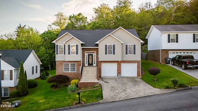241 Stone Edge Cir, Kingsport, TN 37660 - split foyer home with an attached garage, concrete driveway, a front yard, and brick siding