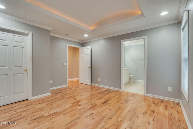 241 Stone Edge Cir, Kingsport, TN 37660 - unfurnished bedroom featuring recessed lighting, a tray ceiling, light wood-style flooring, and ensuite bath