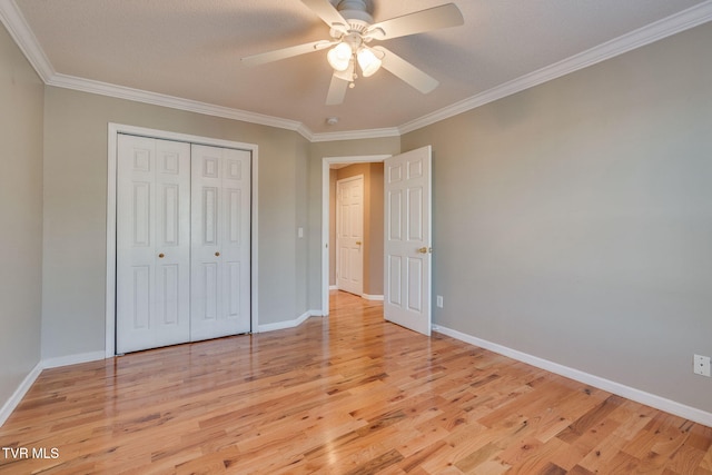 241 Stone Edge Cir, Kingsport, TN 37660 - unfurnished bedroom featuring a closet, baseboards, ornamental molding, and light wood-style floors