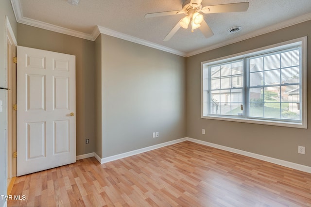 241 Stone Edge Cir, Kingsport, TN 37660 - unfurnished room with a textured ceiling, ornamental molding, light wood-style flooring, and visible vents