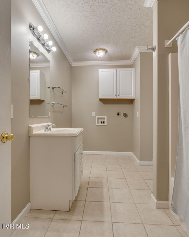 241 Stone Edge Cir, Kingsport, TN 37660 - laundry area featuring laundry area, a textured ceiling, crown molding, light tile patterned floors, and hookup for a washing machine