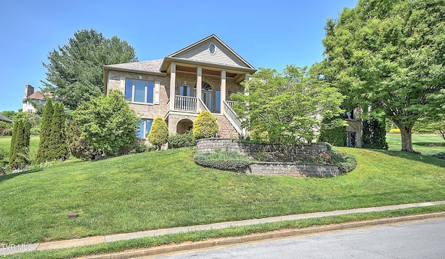 2304 Granite Dr, Johnson City, TN 37604 - greek revival house with stairs, brick siding, and a front yard