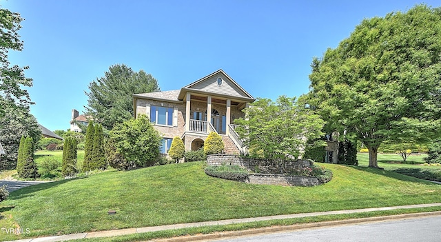 2304 Granite Dr, Johnson City, TN 37604 - neoclassical / greek revival house with a porch, brick siding, stairs, and a front yard