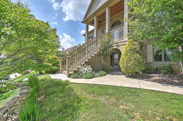 2304 Granite Dr, Johnson City, TN 37604 - exterior space with stairs, a front lawn, and brick siding
