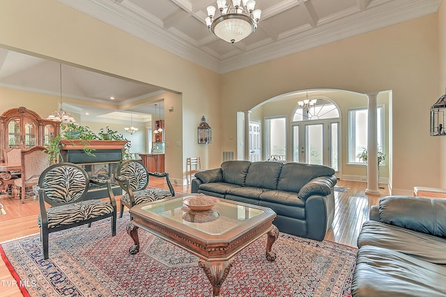 2304 Granite Dr, Johnson City, TN 37604 - living room with arched walkways, a chandelier, and light wood-style floors