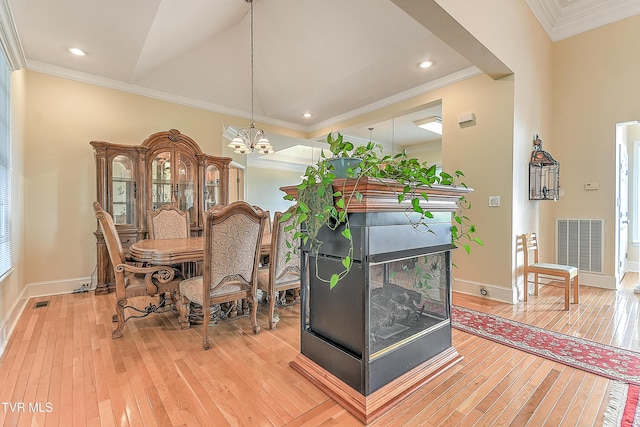 2304 Granite Dr, Johnson City, TN 37604 - dining room featuring crown molding, a notable chandelier, light wood-style flooring, and visible vents