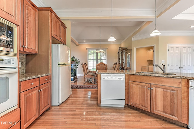 2304 Granite Dr, Johnson City, TN 37604 - kitchen with a sink, light wood-style floors, white appliances, and brown cabinetry