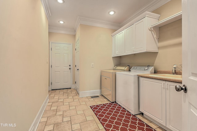 2304 Granite Dr, Johnson City, TN 37604 - clothes washing area featuring a sink, baseboards, cabinet space, and washer and clothes dryer