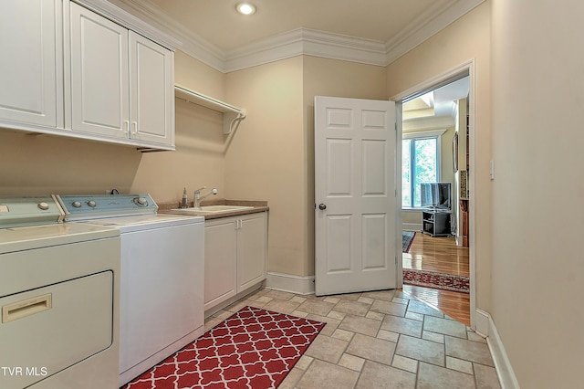2304 Granite Dr, Johnson City, TN 37604 - washroom with crown molding, stone tile floors, baseboards, a sink, and cabinet space
