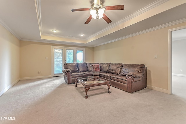 2304 Granite Dr, Johnson City, TN 37604 - living room with light colored carpet, a ceiling fan, baseboards, a tray ceiling, and ornamental molding