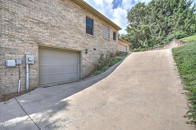 2304 Granite Dr, Johnson City, TN 37604 - view of side of home featuring driveway and a garage