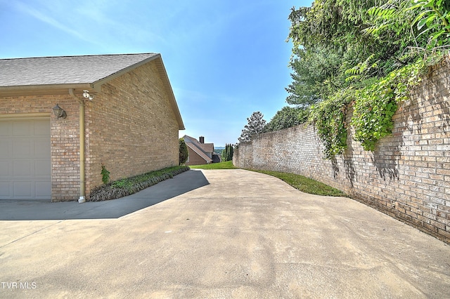 2304 Granite Dr, Johnson City, TN 37604 - view of property exterior with brick siding and a shingled roof
