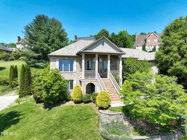 2304 Granite Dr, Johnson City, TN 37604 - neoclassical / greek revival house featuring stairway, brick siding, a porch, and a front lawn
