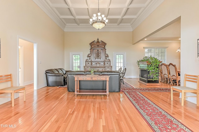 2304 Granite Dr, Johnson City, TN 37604 - living room featuring light wood-style floors, coffered ceiling, a towering ceiling, and a notable chandelier