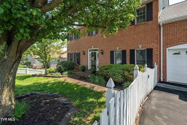 436 Headtown Rd, Jonesborough, TN 37659 - colonial inspired home featuring fence, a front lawn, and brick siding