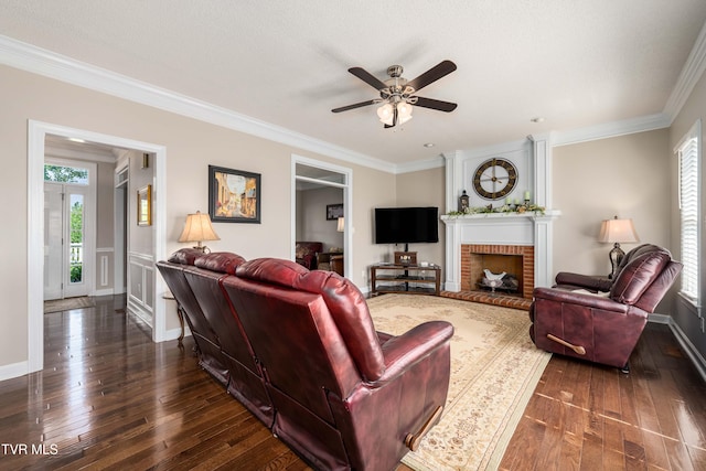 436 Headtown Rd, Jonesborough, TN 37659 - living area featuring a fireplace, a ceiling fan, ornamental molding, and dark wood-type flooring