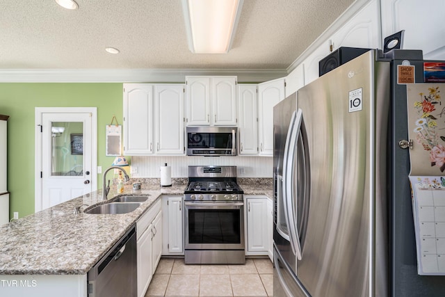 436 Headtown Rd, Jonesborough, TN 37659 - kitchen with white cabinets, stainless steel appliances, a sink, and a peninsula