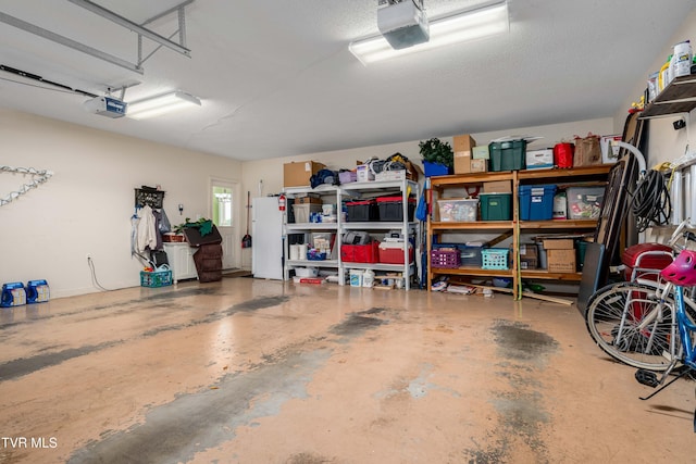 436 Headtown Rd, Jonesborough, TN 37659 - garage featuring a garage door opener and freestanding refrigerator