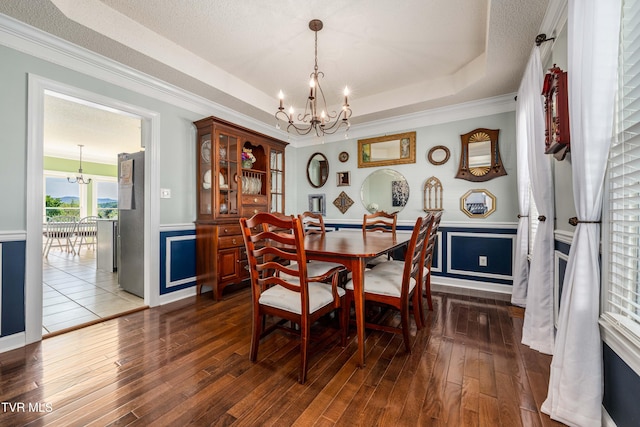 436 Headtown Rd, Jonesborough, TN 37659 - dining area featuring a chandelier, dark wood finished floors, and a wainscoted wall