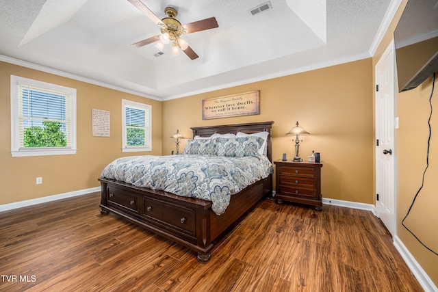 436 Headtown Rd, Jonesborough, TN 37659 - bedroom featuring visible vents, ornamental molding, baseboards, dark wood-type flooring, and a raised ceiling