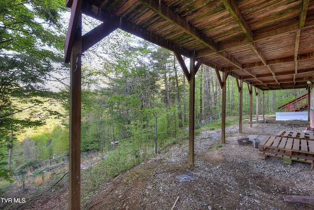 view of yard with a wooded view