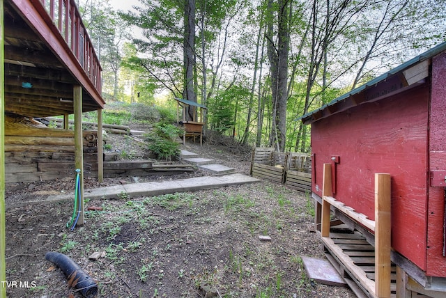 view of yard featuring fence and a vegetable garden