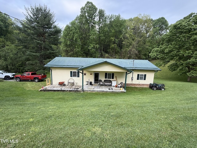 125 Babb Rd, Elizabethton, TN 37643 - back of house featuring a lawn, a forest view, metal roof, and a wooden deck