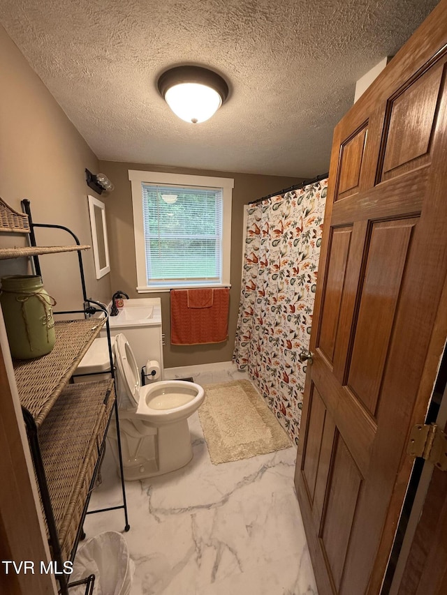 125 Babb Rd, Elizabethton, TN 37643 - bathroom featuring a textured ceiling, marble finish floor, a shower with shower curtain, and toilet