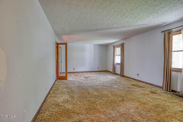 2653 Suffolk St, Kingsport, TN 37660 - carpeted spare room featuring a textured ceiling and baseboards