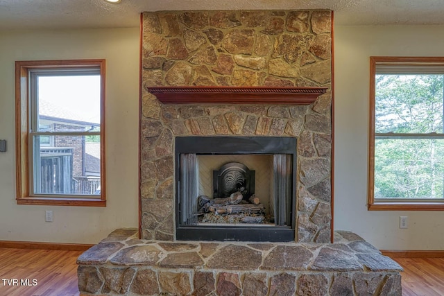 2653 Suffolk St, Kingsport, TN 37660 - detailed view of wood finished floors, baseboards, and a fireplace