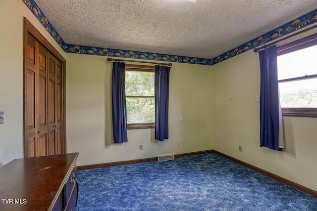 2653 Suffolk St, Kingsport, TN 37660 - unfurnished room featuring carpet flooring, a textured ceiling, and baseboards