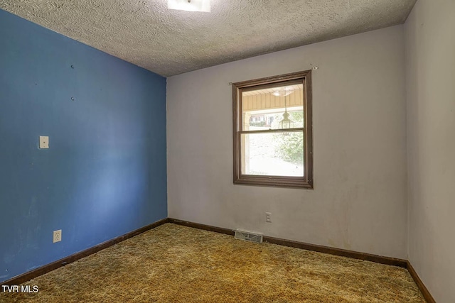 2653 Suffolk St, Kingsport, TN 37660 - spare room with carpet floors, a textured ceiling, and baseboards