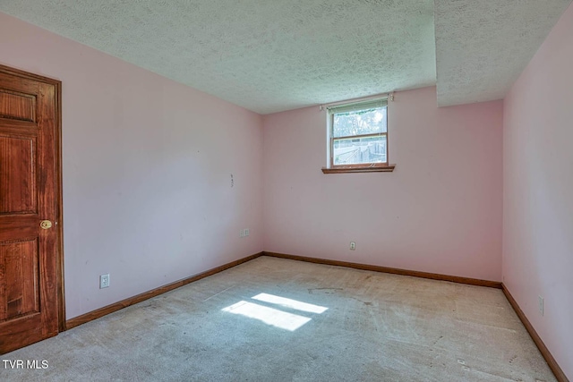 2653 Suffolk St, Kingsport, TN 37660 - empty room with light colored carpet, a textured ceiling, and baseboards