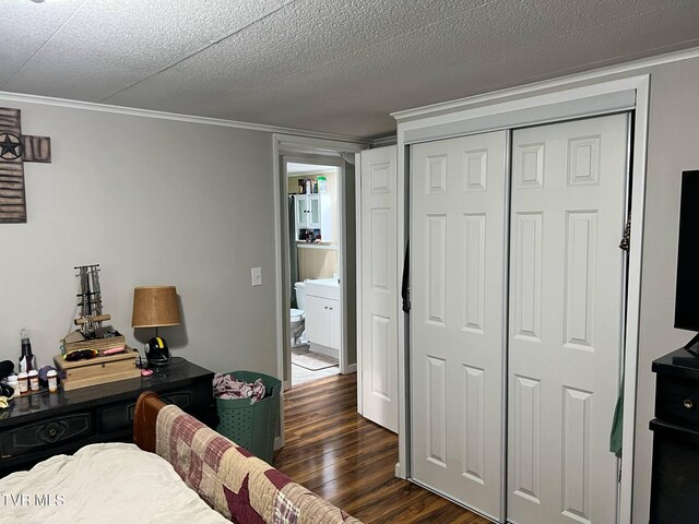 1220 2nd Ave, Big Stone Gap, VA 24219 - bedroom with crown molding, dark wood-style floors, and a closet