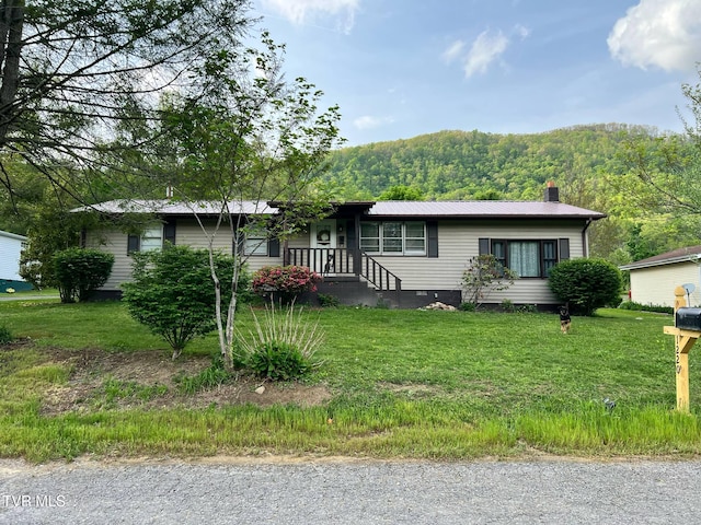 1220 2nd Ave, Big Stone Gap, VA 24219 - single story home with a chimney, a front lawn, a wooded view, and metal roof