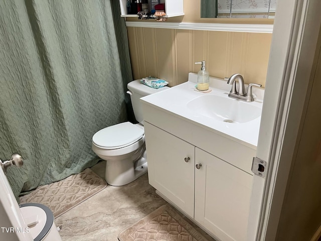 1220 2nd Ave, Big Stone Gap, VA 24219 - full bath featuring a decorative wall, vanity, toilet, a wainscoted wall, and curtained shower