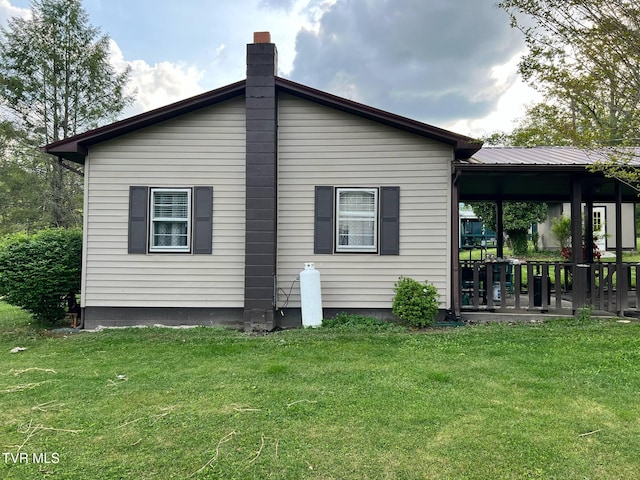 1220 2nd Ave, Big Stone Gap, VA 24219 - rear view of house with a yard and a chimney