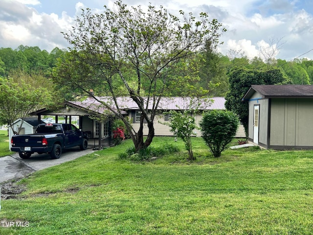 1220 2nd Ave, Big Stone Gap, VA 24219 - ranch-style home featuring an outbuilding, a shed, and a front yard
