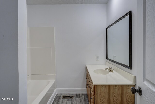 bathroom featuring vanity and baseboards