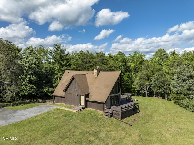 505 Duel Ln, Jonesborough, TN 37659 - view of front of home featuring a front yard, a chimney, a view of trees, a shingled roof, and a wooden deck