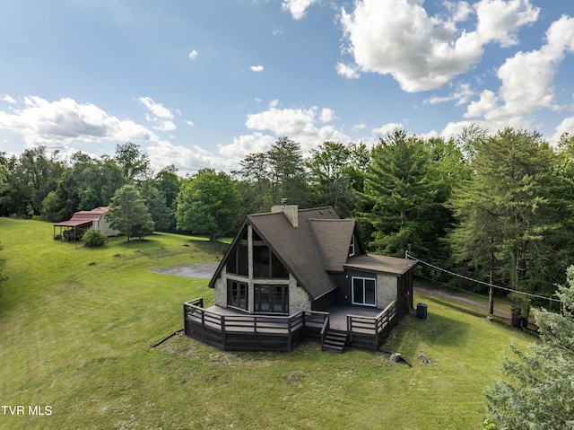 505 Duel Ln, Jonesborough, TN 37659 - rear view of property with a chimney, a yard, stone siding, a wooden deck, and a forest view