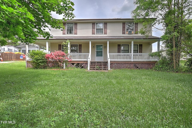 view of front facade featuring covered porch and a front yard