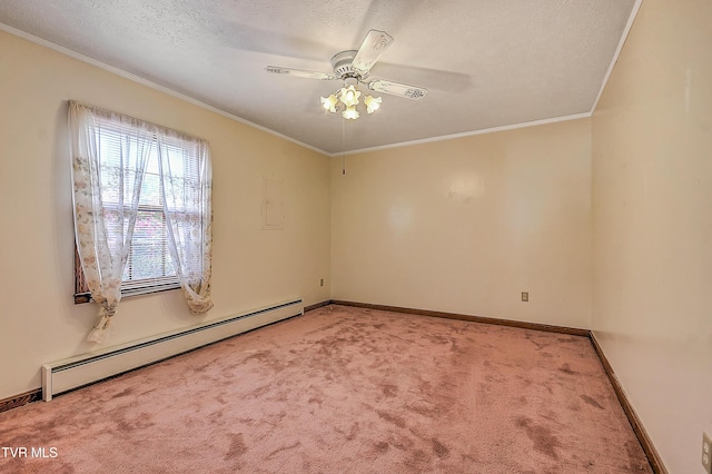 carpeted spare room featuring ornamental molding, baseboards, ceiling fan, baseboard heating, and a textured ceiling