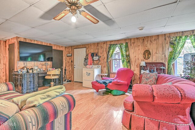 3851 Helen Henderson Hwy, Davenport, VA 24239 - living room with wood walls, washer / dryer, a drop ceiling, and a healthy amount of sunlight