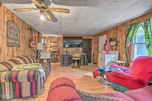 3851 Helen Henderson Hwy, Davenport, VA 24239 - living room with washer and clothes dryer, ceiling fan, wood finished floors, and wooden walls