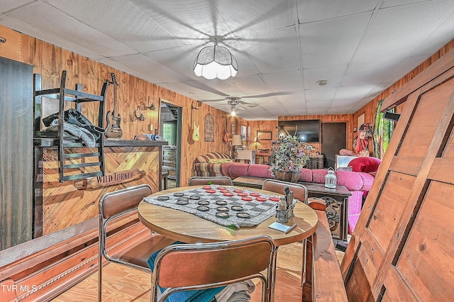 3851 Helen Henderson Hwy, Davenport, VA 24239 - dining space with wood walls, a ceiling fan, and wood finished floors