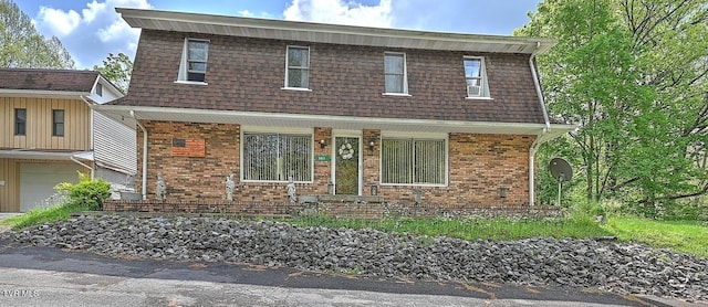 3851 Helen Henderson Hwy, Davenport, VA 24239 - view of front facade with roof with shingles, covered porch, an attached garage, and brick siding