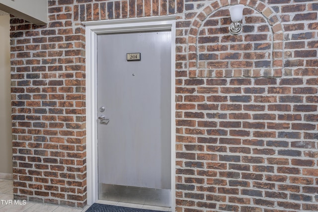 200 E Main St Unit 201, Johnson City, TN 37604 - view of exterior entry featuring brick siding