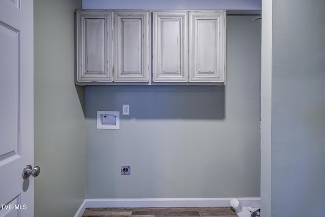 200 E Main St Unit 201, Johnson City, TN 37604 - washroom with washer hookup, hookup for an electric dryer, wood finished floors, and cabinet space
